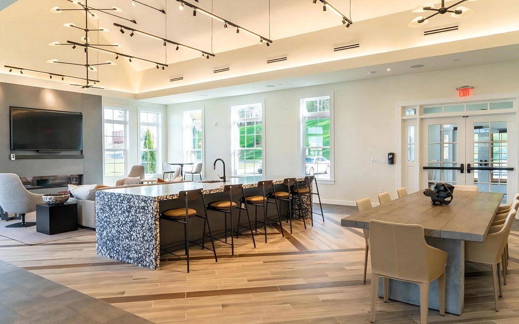 Lounge Featuring Couches and a Large Table