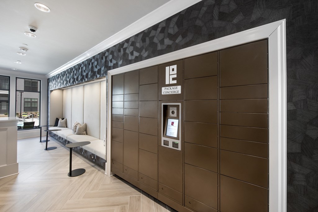 Mail Room Featuring Self-Service Package Lockers and Padded Bench Seating