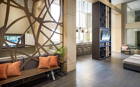 Community Lounge with Decorative Partition, TV, and Bar Seating