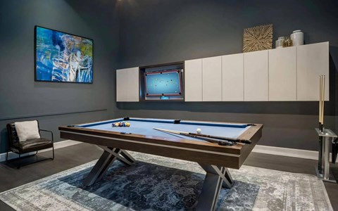 Private Game Room with Pool Table and Wall-Mounted Art