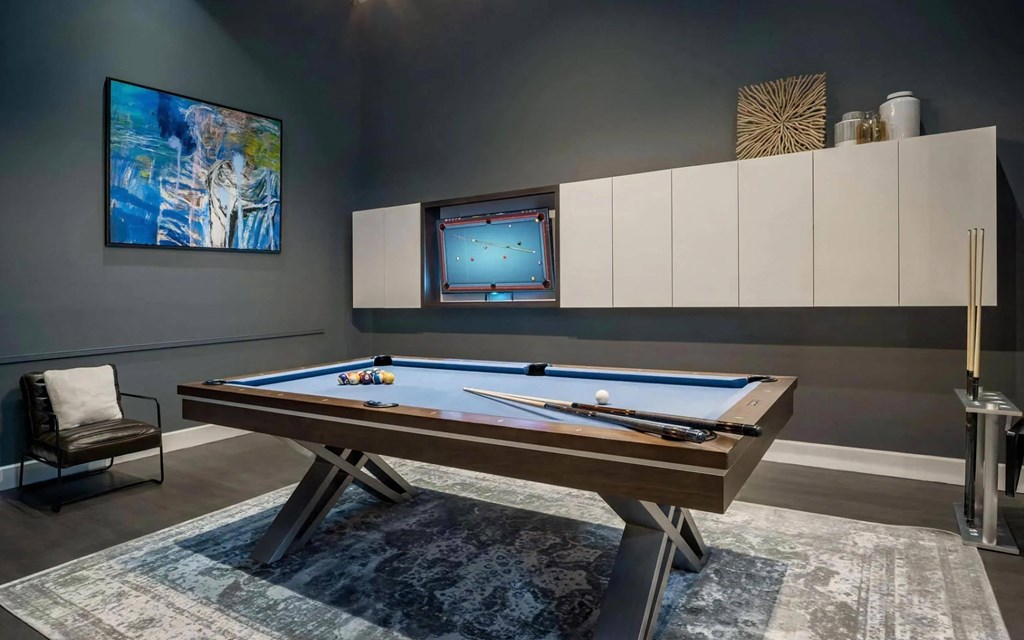 Private Game Room with Pool Table and Wall-Mounted Art Private Game Room with Pool Table and Wall-Mounted Art
