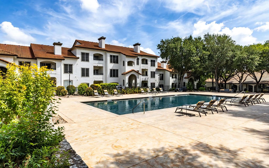 Mesa Verde Pool Resort Style Pool with Sundeck Lounger Seating Natural Foliage