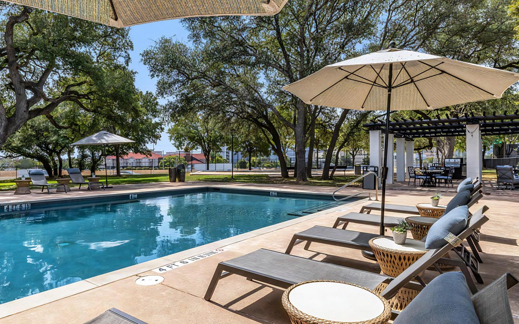 Mesa Verde Pool Second Pool with Sunbathing Loungers Shade Umbrellas and Adjacent Outdoor Covered Lounge