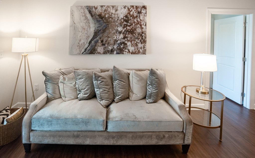 Bright Living Space Featuring Cozy Couch, Abstract Wall Art, and Ambient Lighting