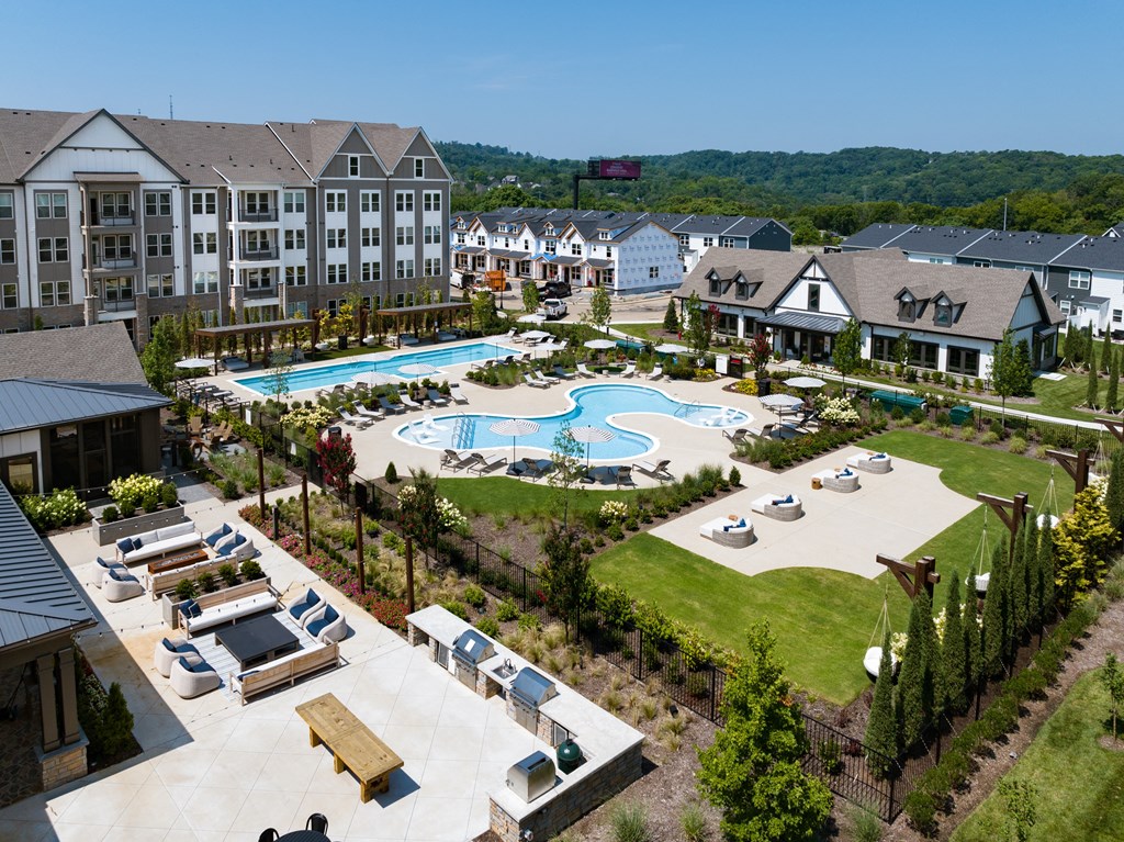Vibrant Courtyard at Harpeth Heights Featuring Pools, Grilling Stations, and Cabanas