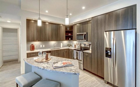 a kitchen with stainless steel appliances and a counter top
