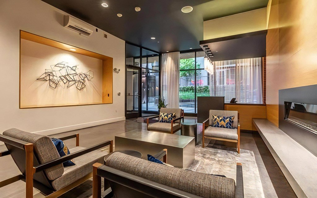 Entrance Lounge Area Featuring Glass Doors and Upholstered Chairs