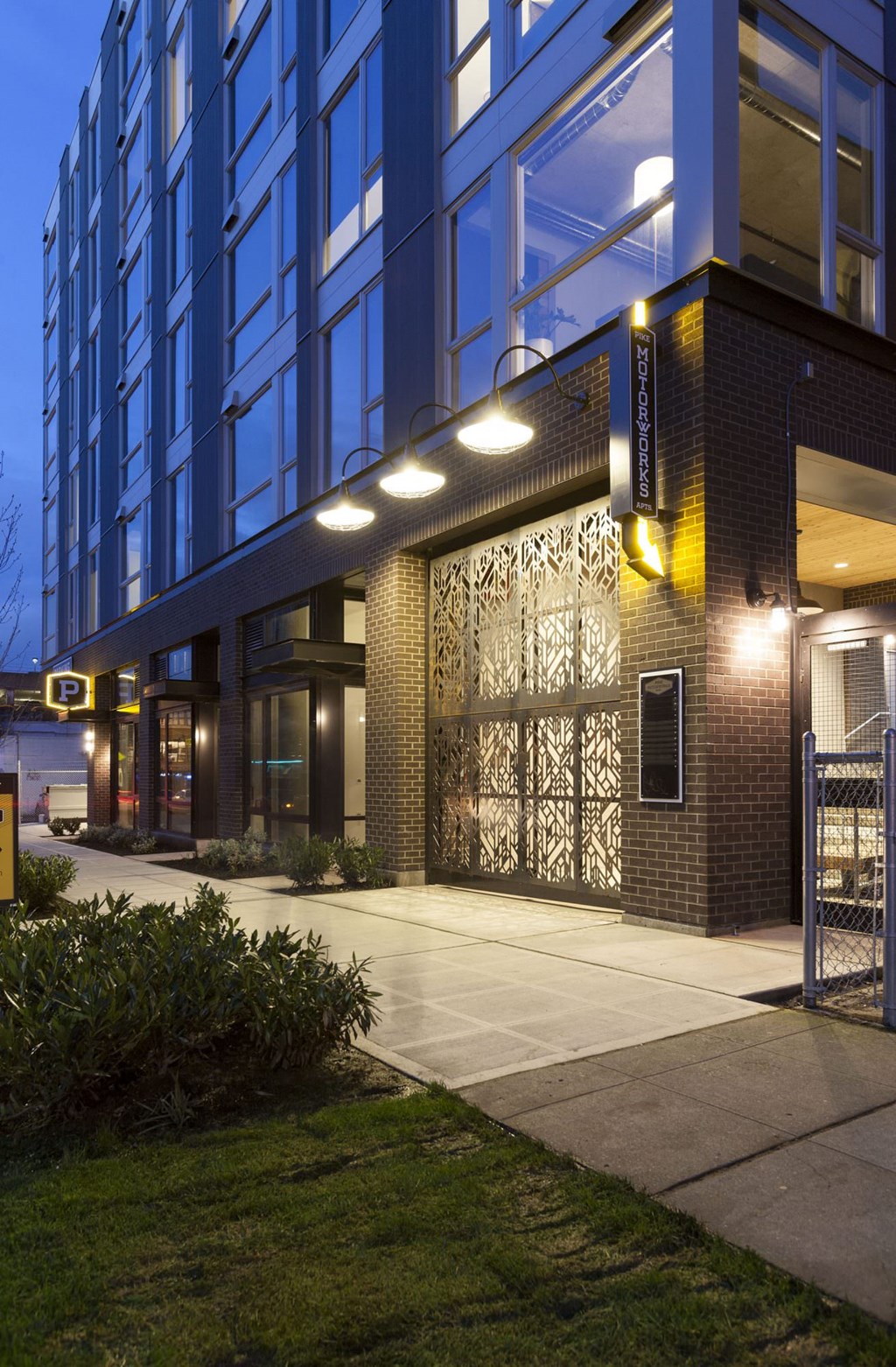 Property Entryway with Signage and Modern Architectural Lighting