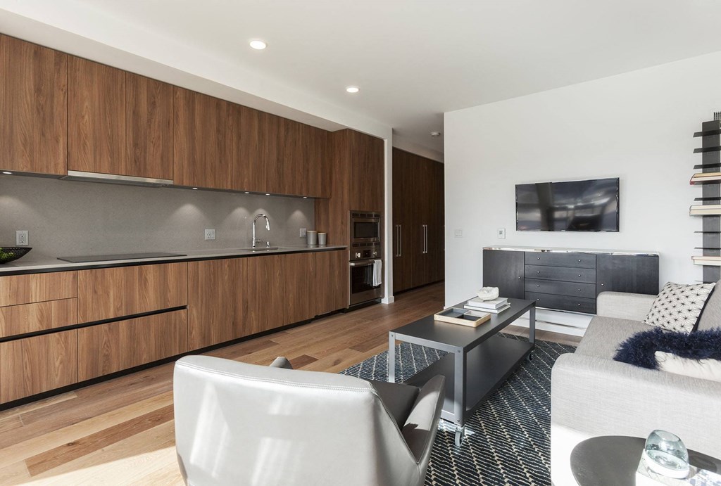 Unit Interior Featuring Full Kitchen Wall and Living Space