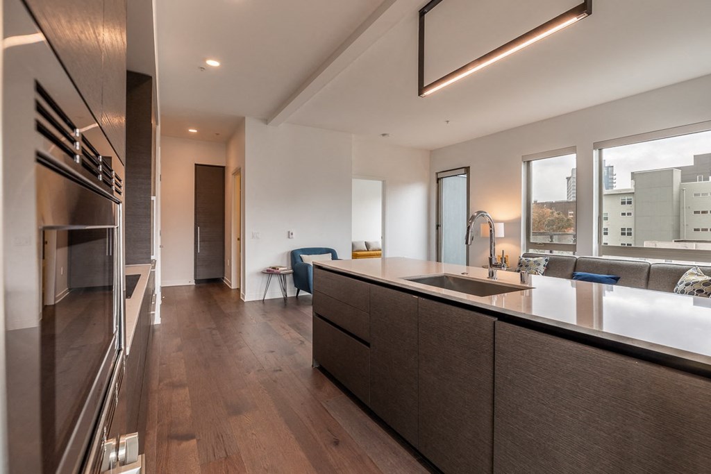 Apartment Interior Featuring Island Kitchen and Large Windows