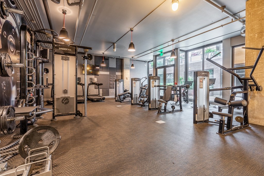 Resident Fitness Studio with Training Stations and Cardio Machines