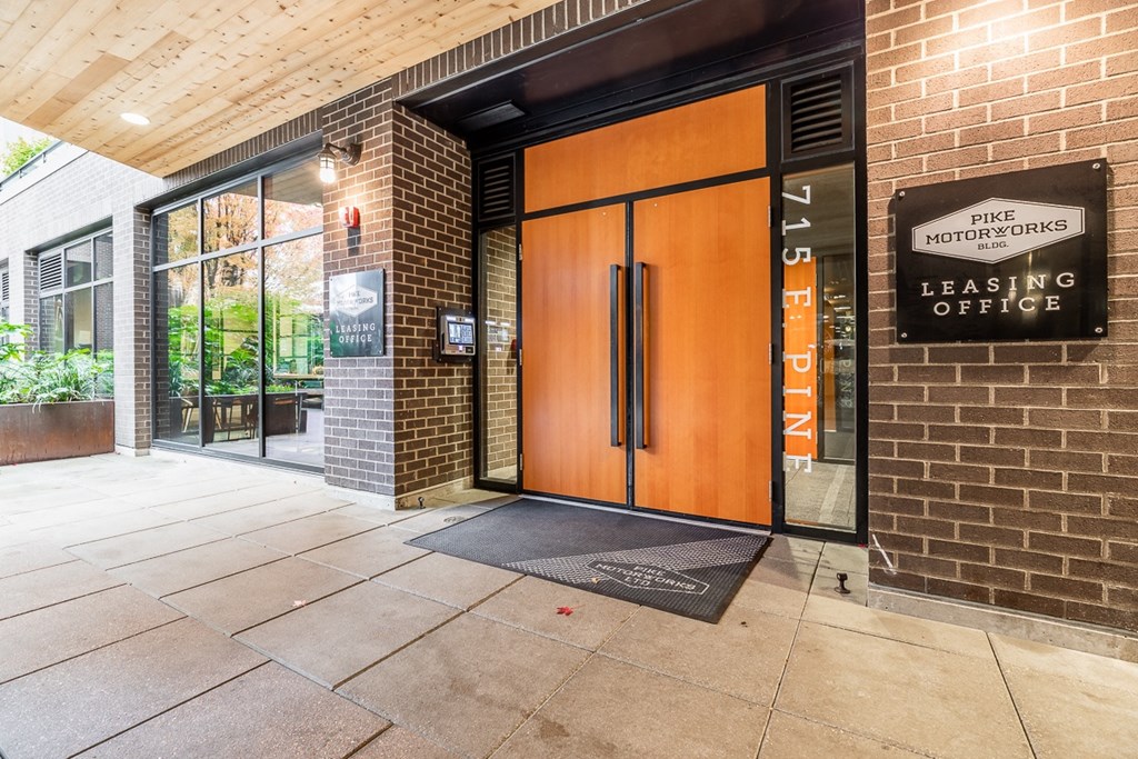Leasing Office Entrance with Glass Windows and Brick Facade