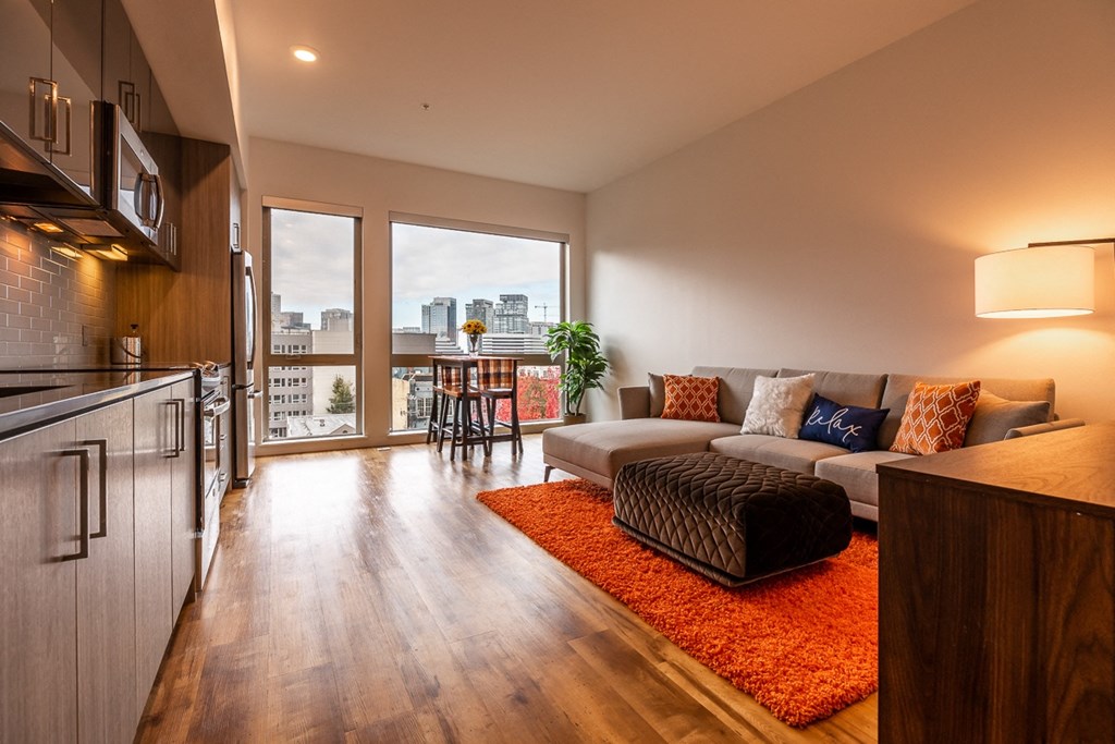 Apartment Interior Featuring Kitchen, Dining Area, and Large Windows