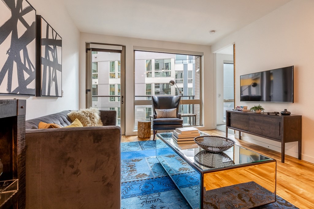 Open Living Space with Large Windows and Contemporary Furnishings