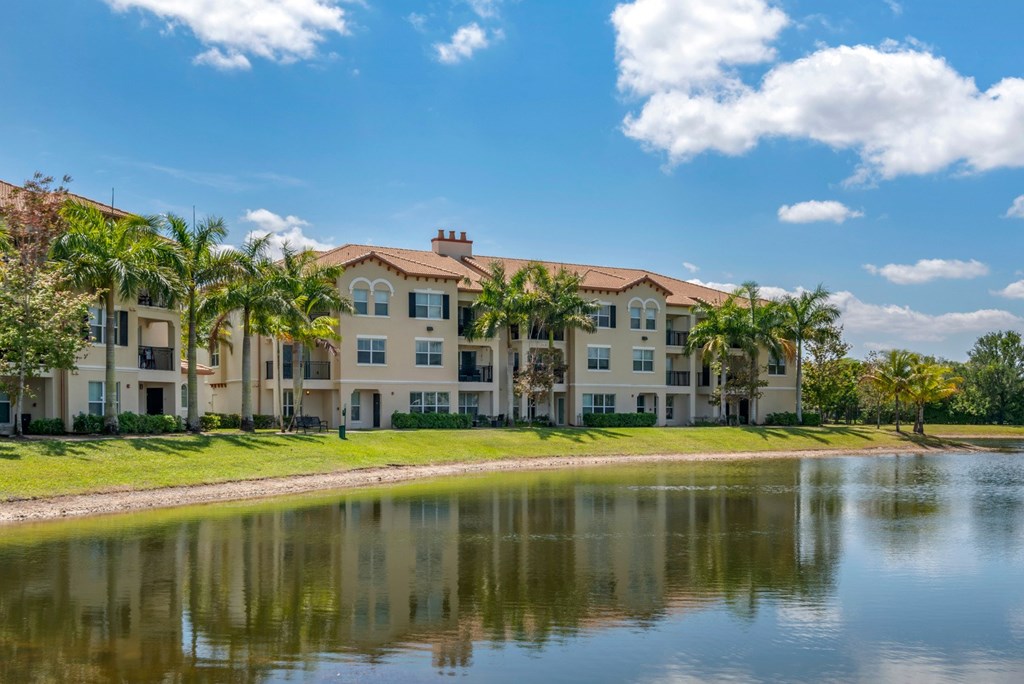 A large building with a lake in front of it.
