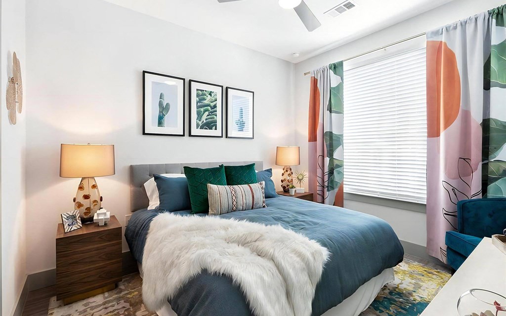 Rhythm Bedroom with Window Coverings, Wall Art, and Overhead Ceiling Fan