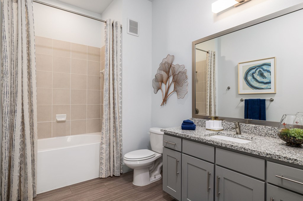 Rhythm Bathroom with Large Shower and Quartz Countertop Vanity