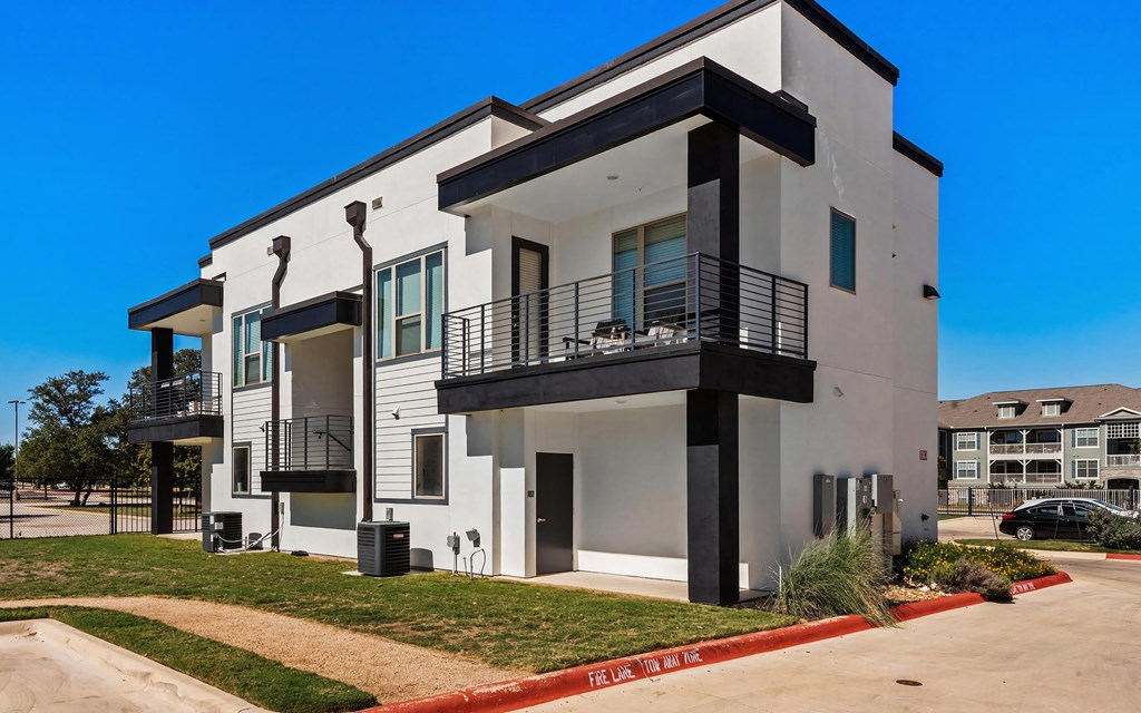 Expansive Outdoor Patios and Bold Black Trim Detailing at Rhythm Apartments