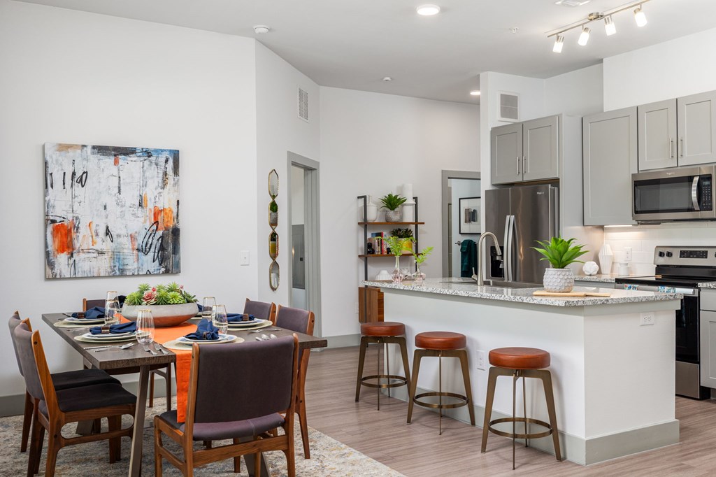 Rhythm High-End Kitchen with Granite Counters and Stainless Steel Appliances