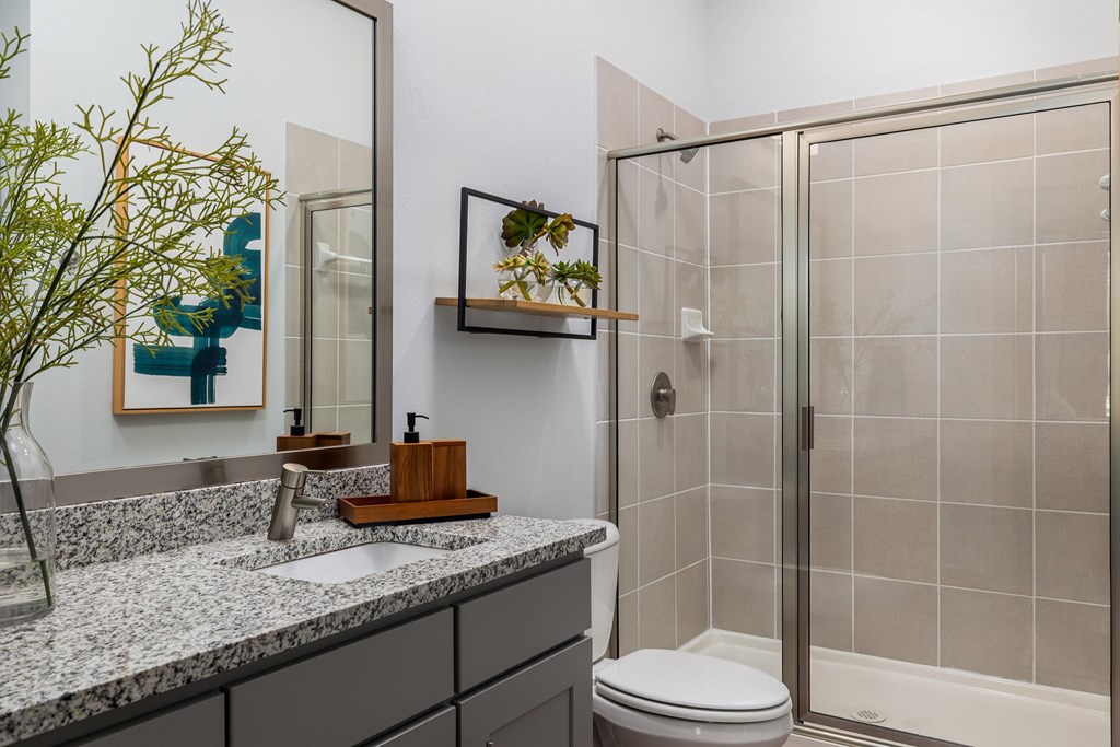 Rhythm Bathroom with Large Shower and Quartz Countertop Vanity