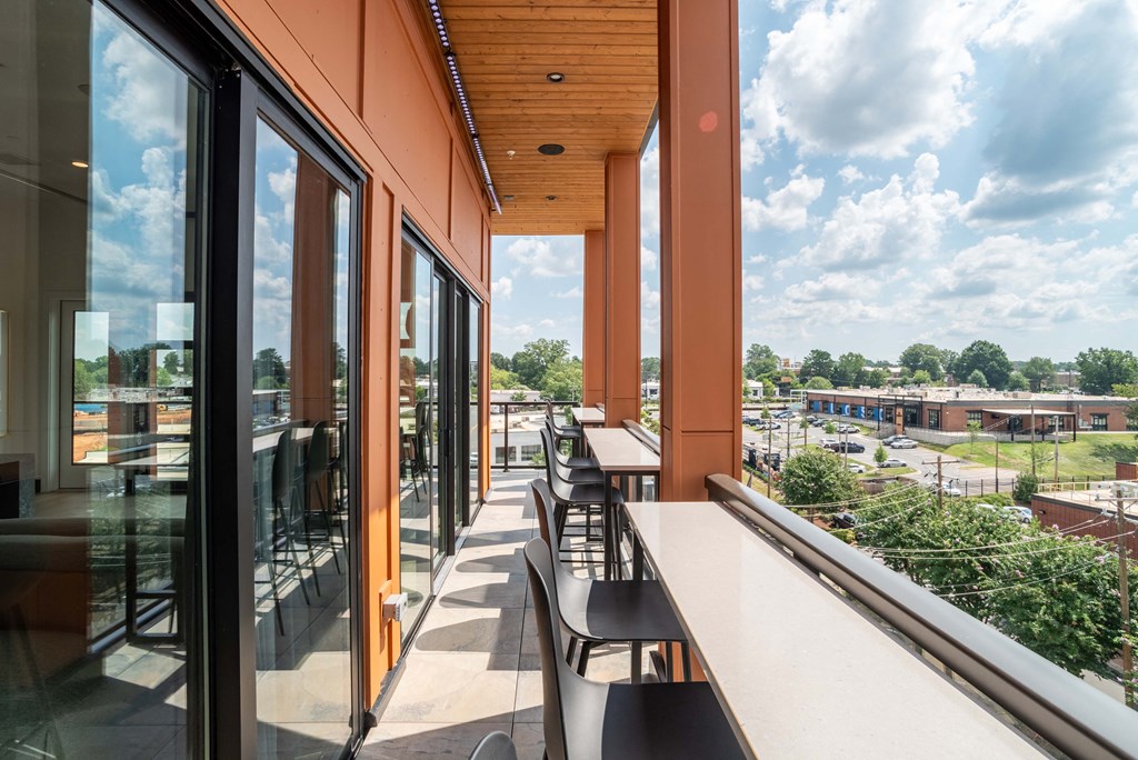 A long hallway with a view of the outdoors.