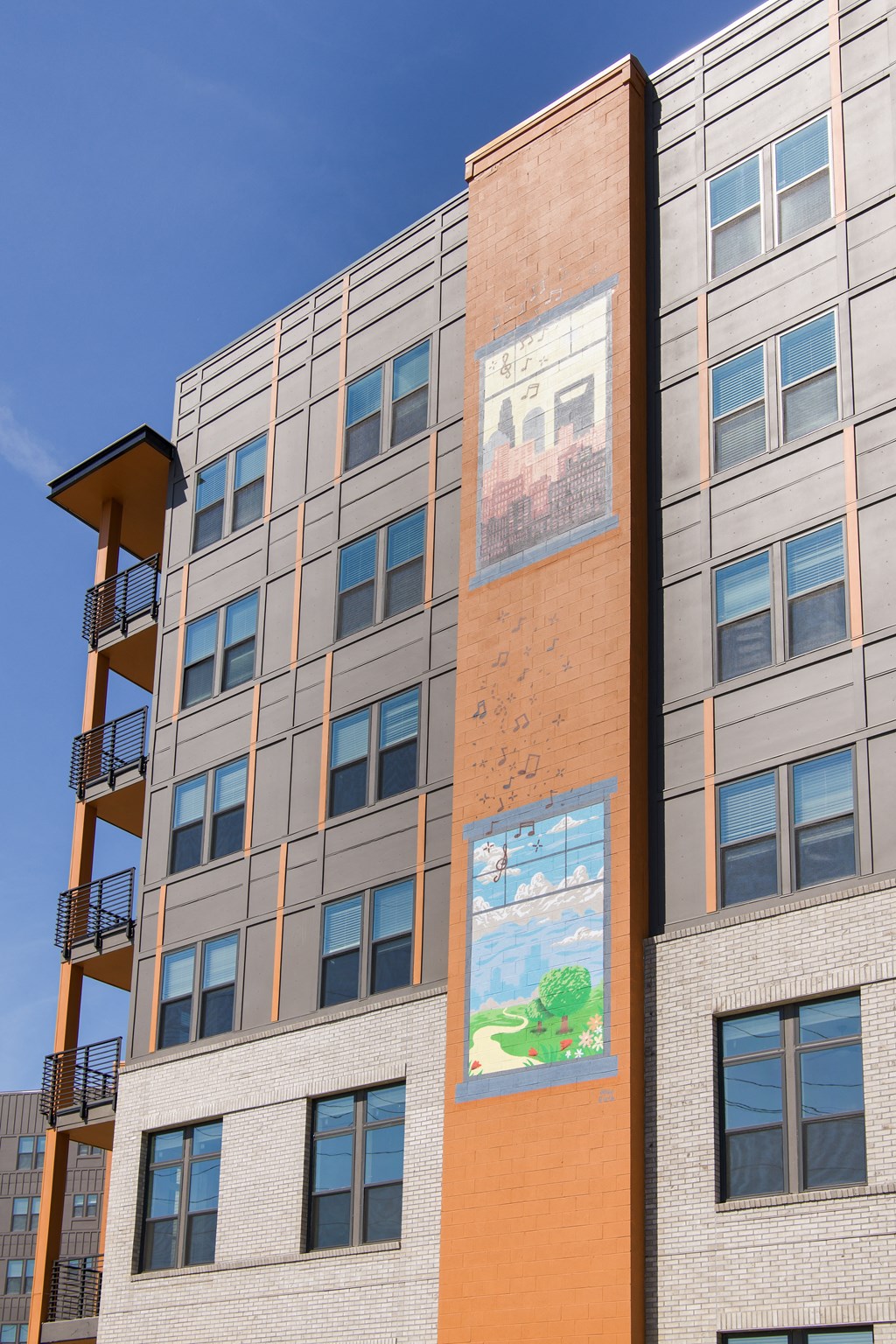 the side of a building with a mural on it