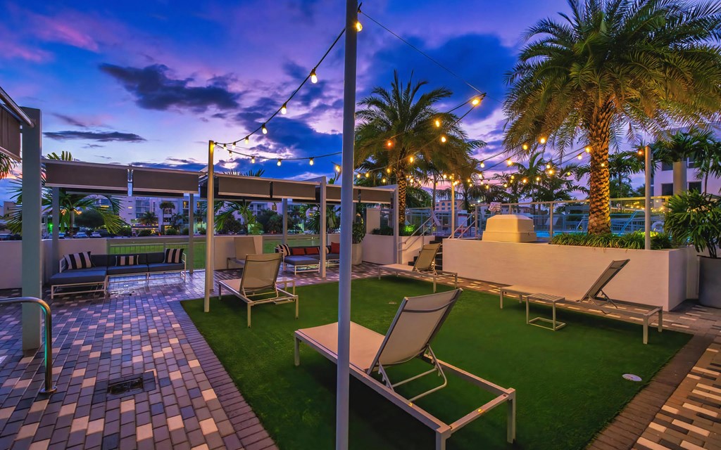 Relaxing Patio with Lounge Chairs and Sunset Sky at South of Atlantic