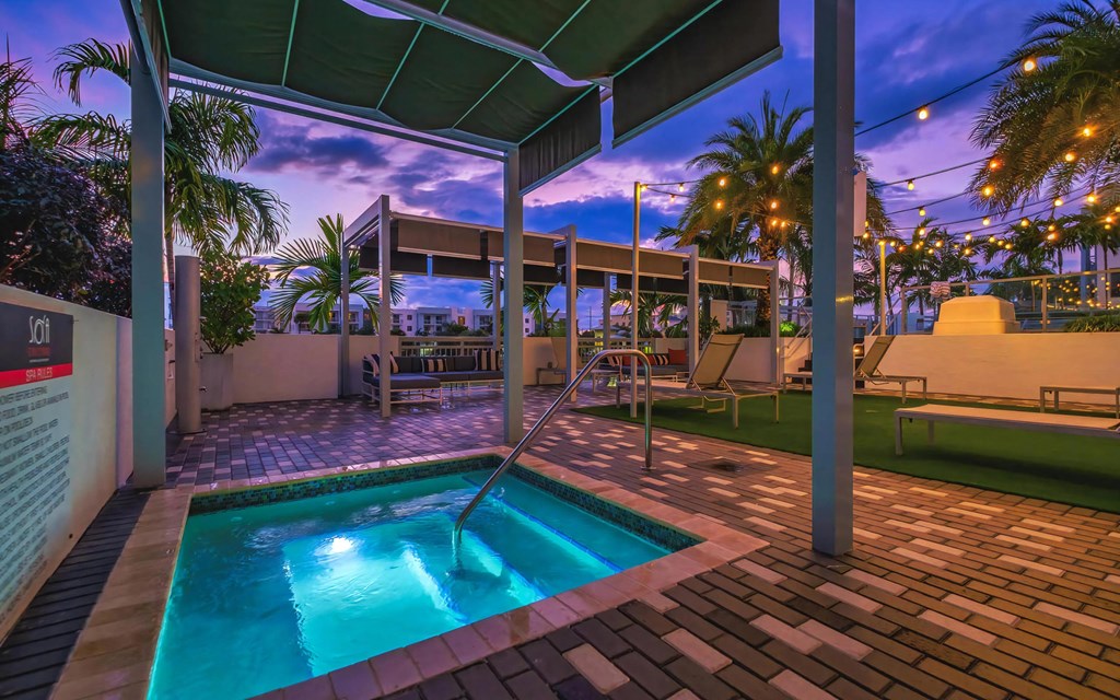 Tranquil Spa Tub Under Canopy and String Lights at South of Atlantic