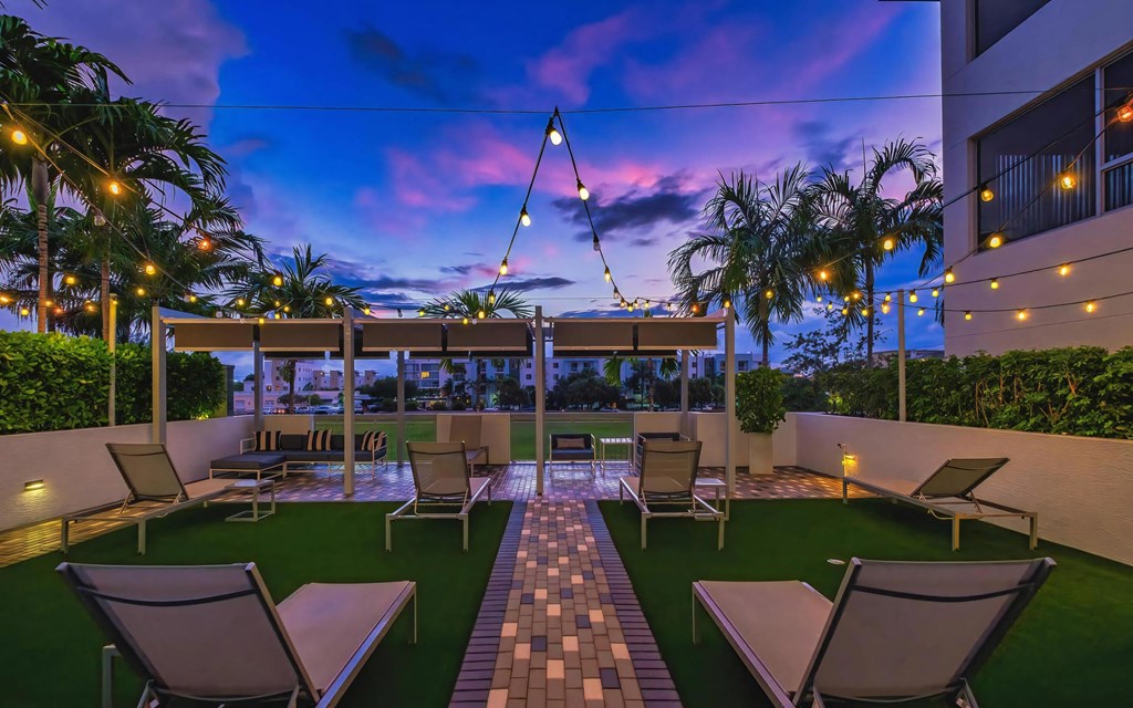 Modern Outdoor Patio with Lounge Seating and String Lights at South of Atlantic