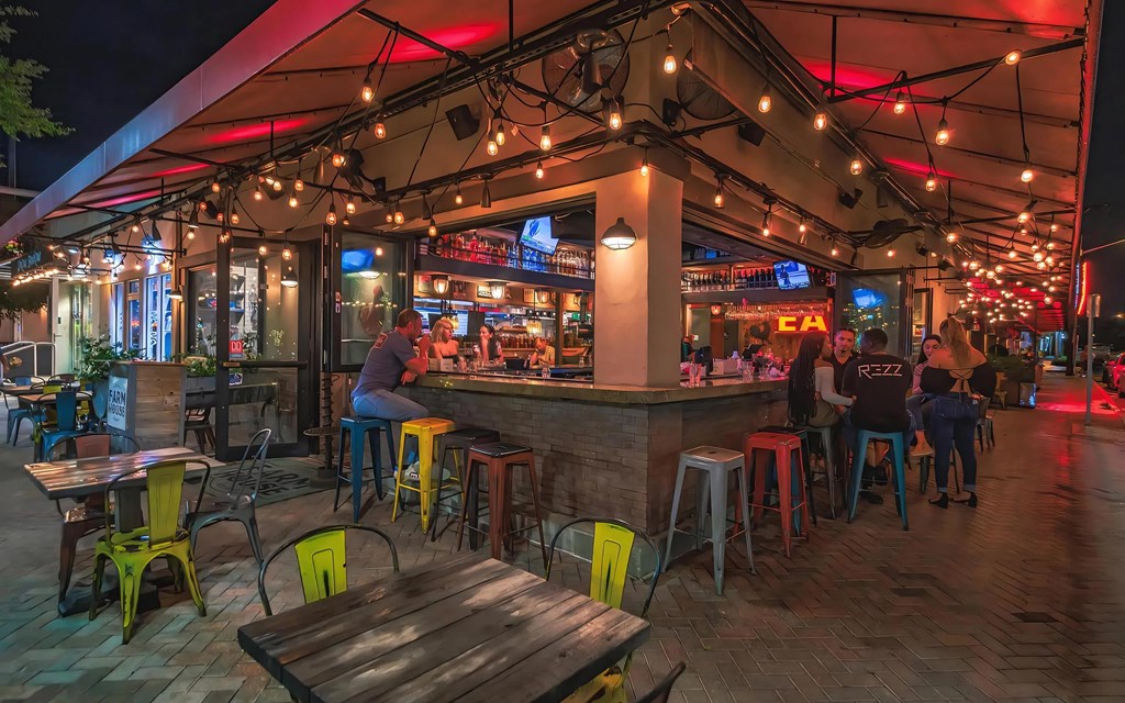 Open-Air Corner Bar with String Lights and Nightlife Vibes