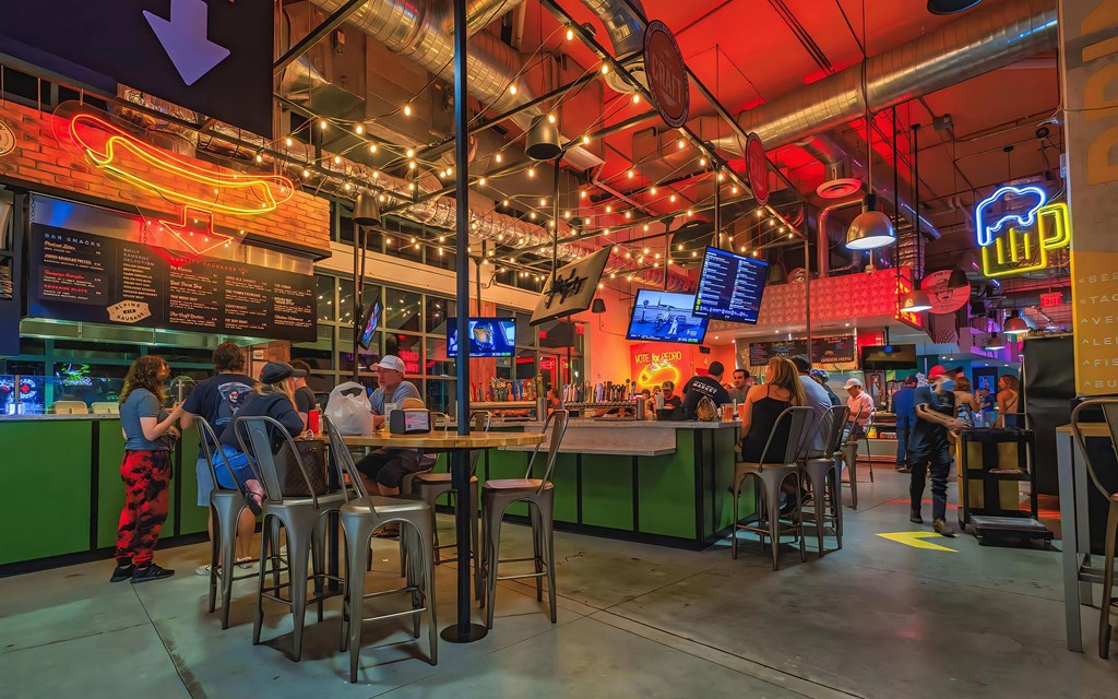 Bustling Bar Scene with String Lights and Social Vibe Close to South of Atlantic