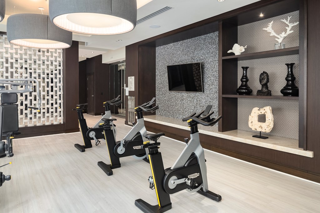 Bike Room with Modern Fitness Bikes and Decorative Wall Accents