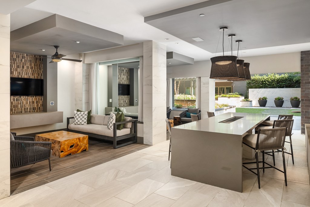 Indoor Lounge Space with Dining Island and Outdoor Courtyard Access