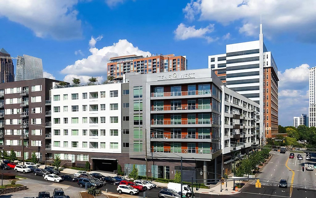 Corner View of Tens on West Apartments With Visible Signage