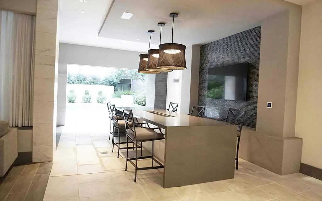 Bar Seating and TV Connected to Courtyard