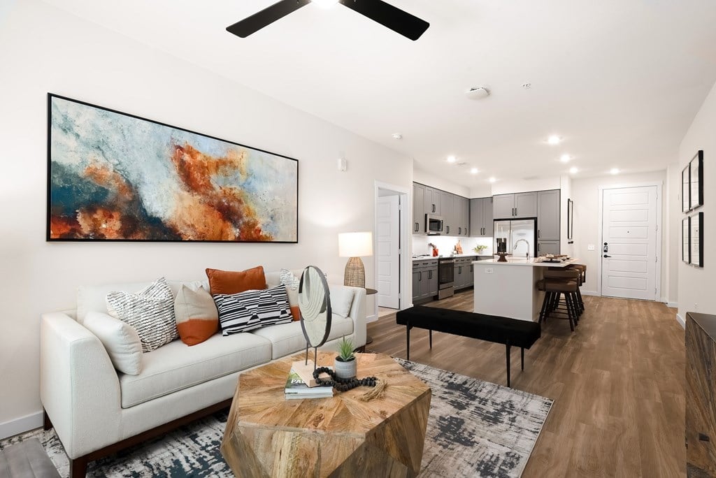 Open-Concept Living Room with Modern Kitchen and Wood-Style Flooring