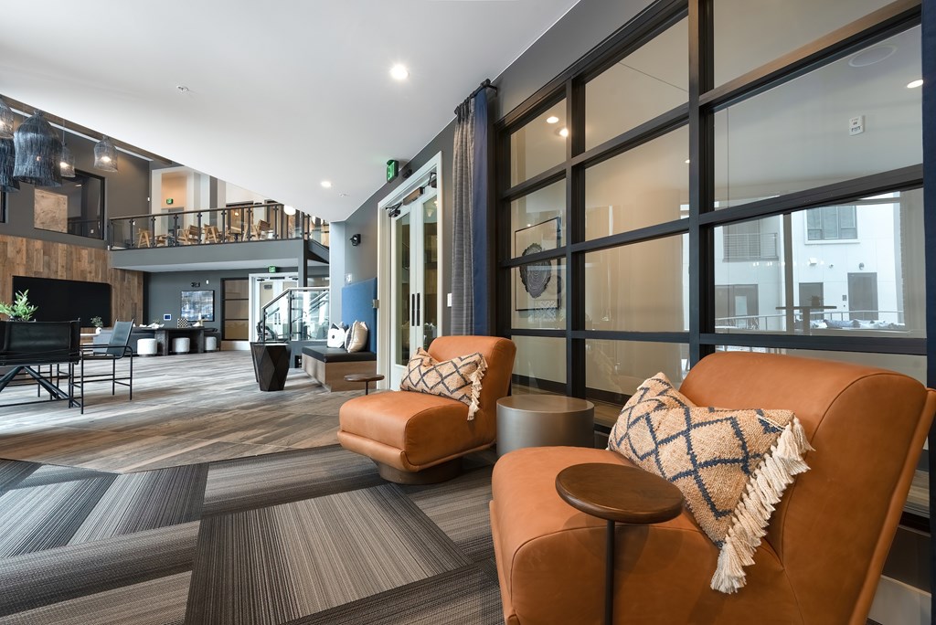 Open-Concept Common Area with Stylish Seating and Lofted Walkways