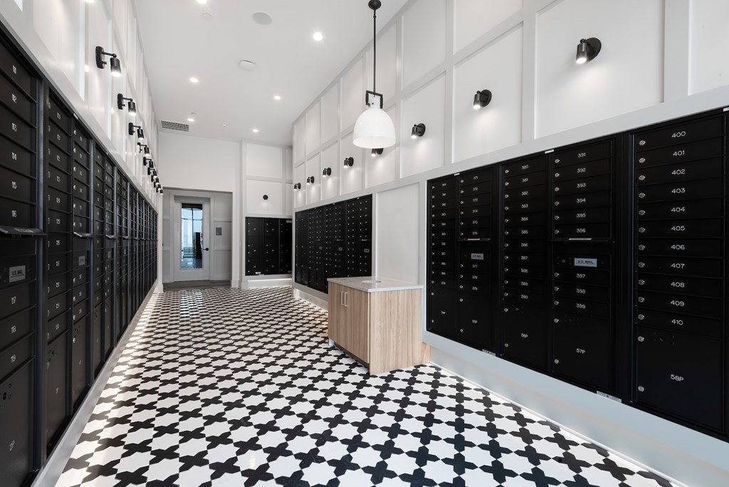 Secure Resident Mailroom with Individual Lockers and Modern Tile Flooring