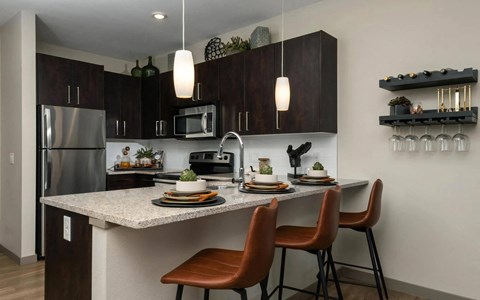 a kitchen with a marble counter top