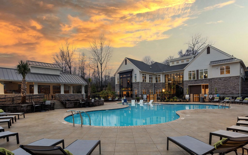 Pool with Clubhouse with Sunset Background