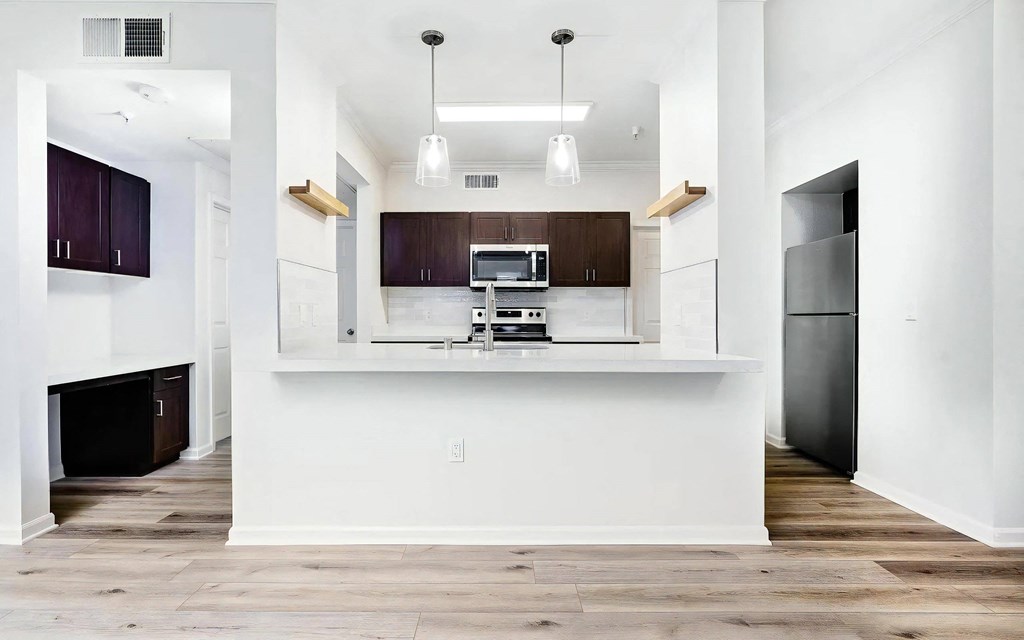 Spacious Kitchen with Breakfast Bar and Built In Workspace