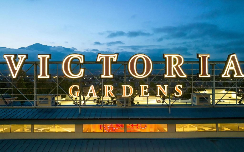 Victoria Gardens Sign Lit in Evening