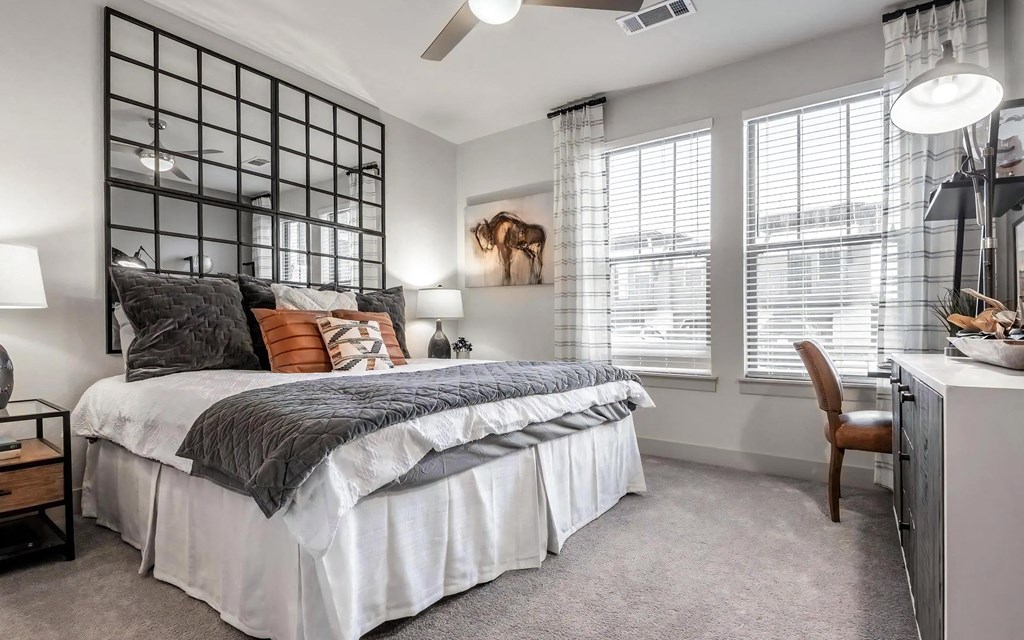 Bright Bedroom with Decorative Mirror Wall and Modern Furnishings Bright Bedroom with Decorative Mirror Wall and Modern Furnishings