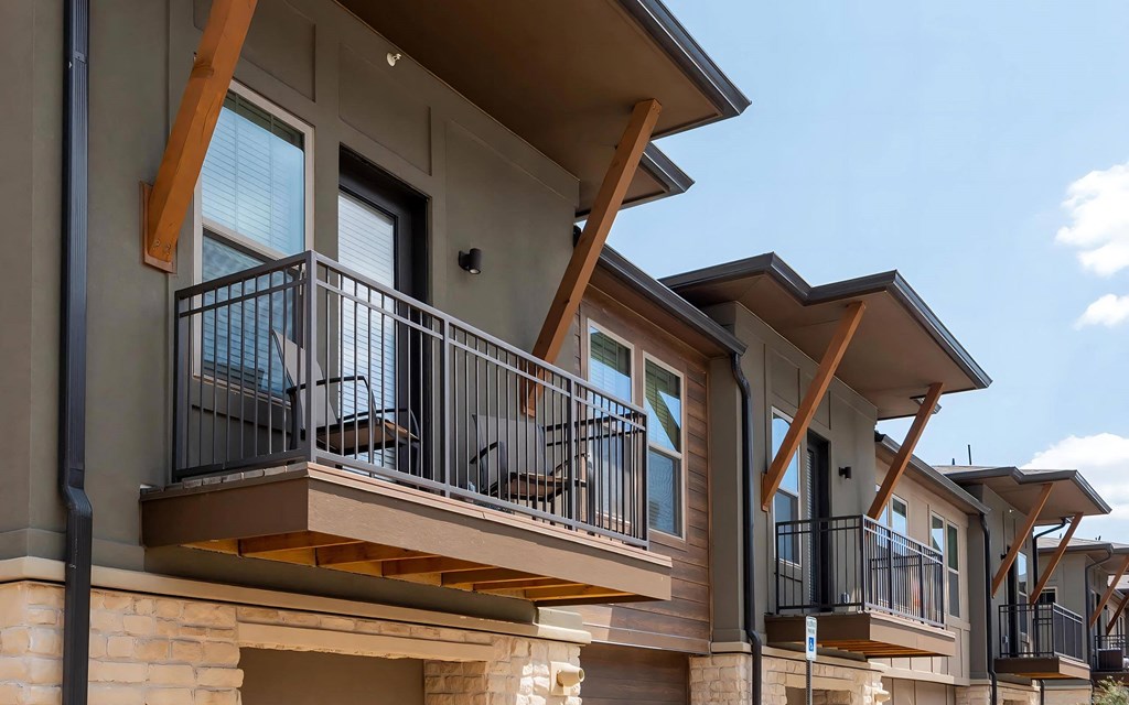 Apartment Exterior Showcasing Private Balcony Access