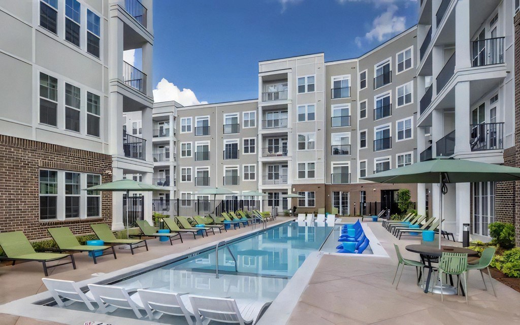 Broadstone Upper Westside Community Pool Resort Style Pool with In Pool Chaise Lounges