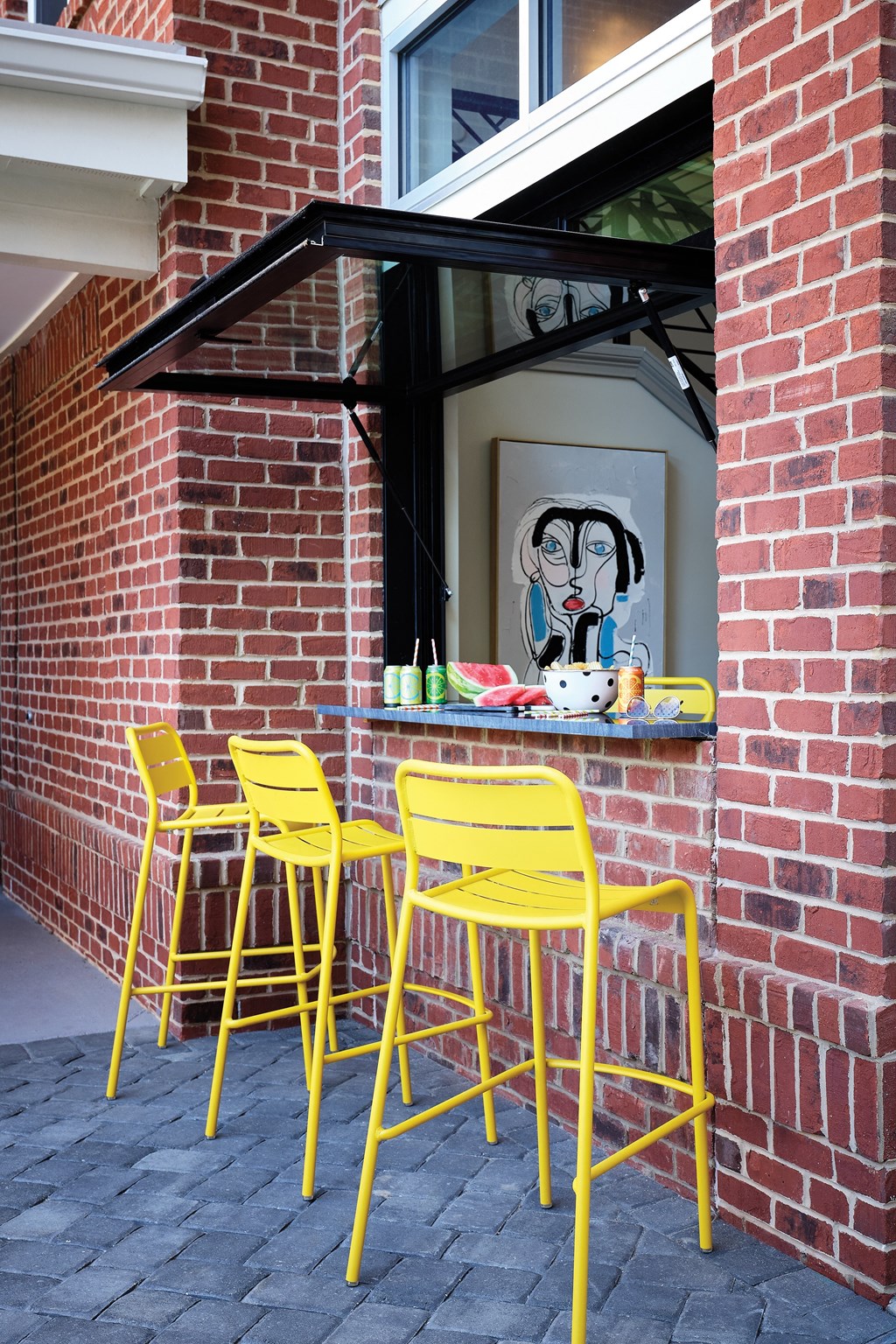 Urban-Style Outdoor Counter with Modern Stools and Refreshments