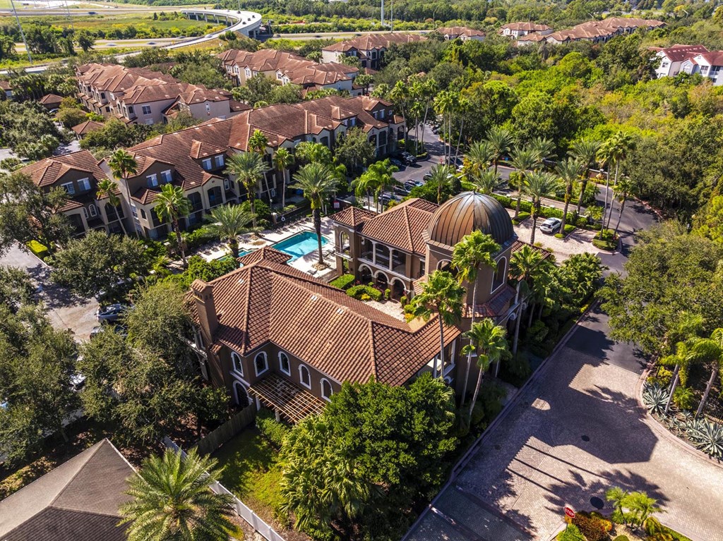 Elevated aerial of clubhouse with domed roof and landscaped courtyard