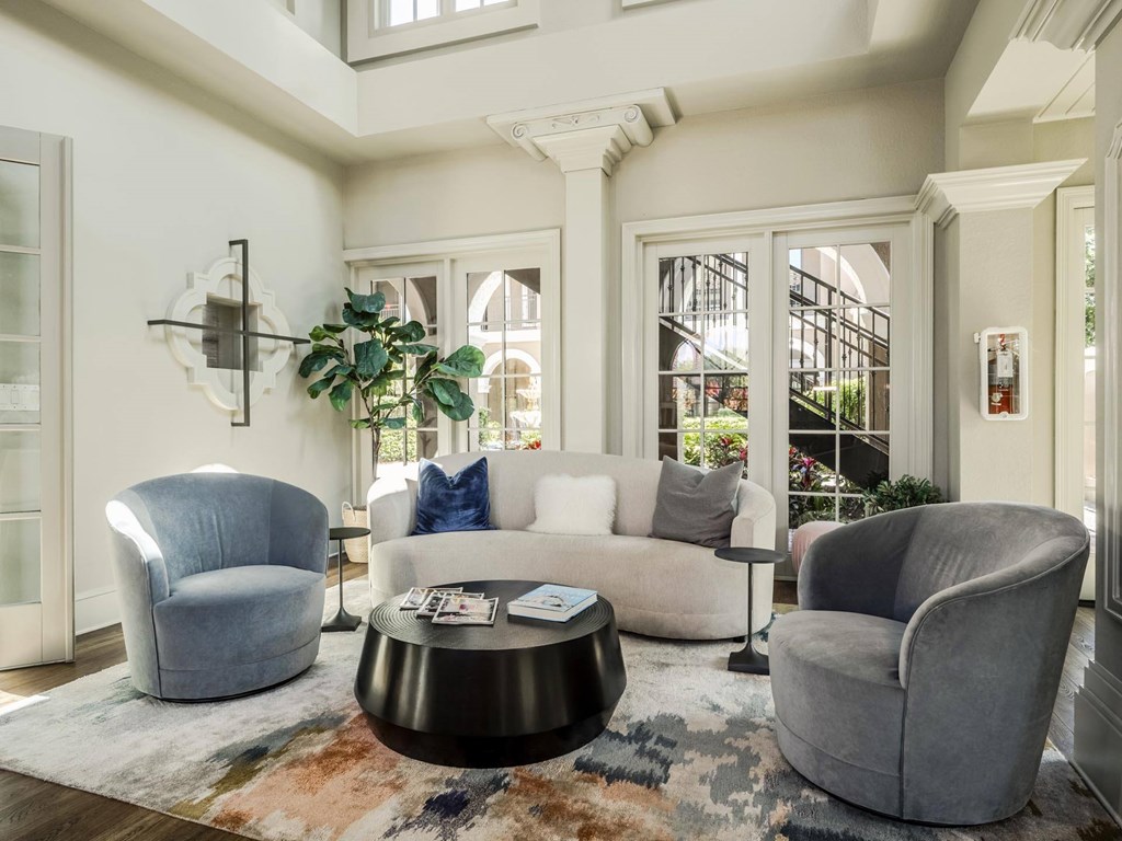 Modern clubhouse lounge with comfortable seating and natural light creating a welcoming atmosphere.