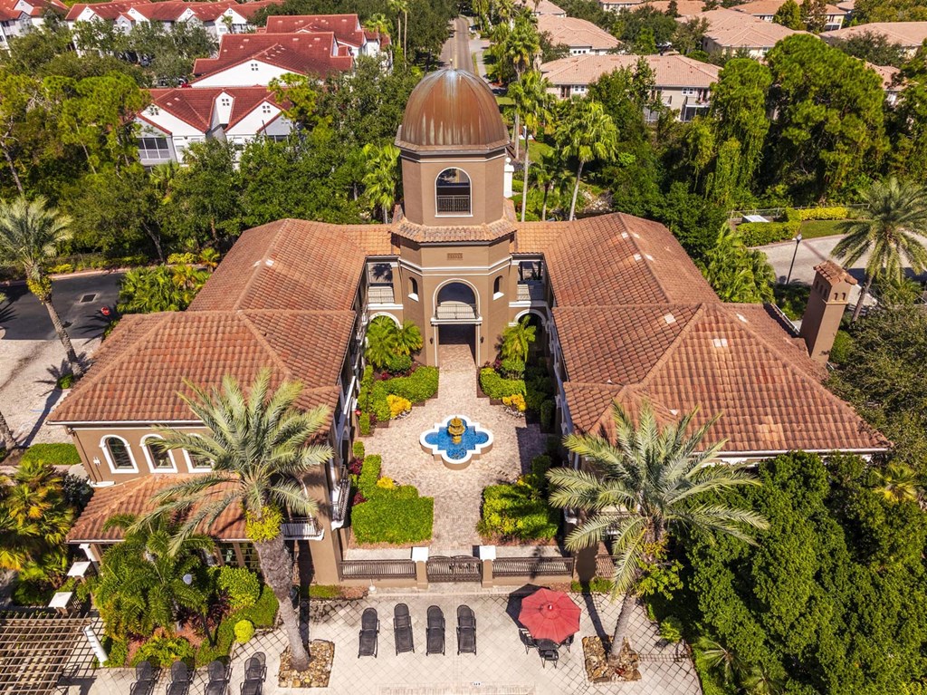 Aerial of clubhouse courtyard with fountain and surrounding palm trees