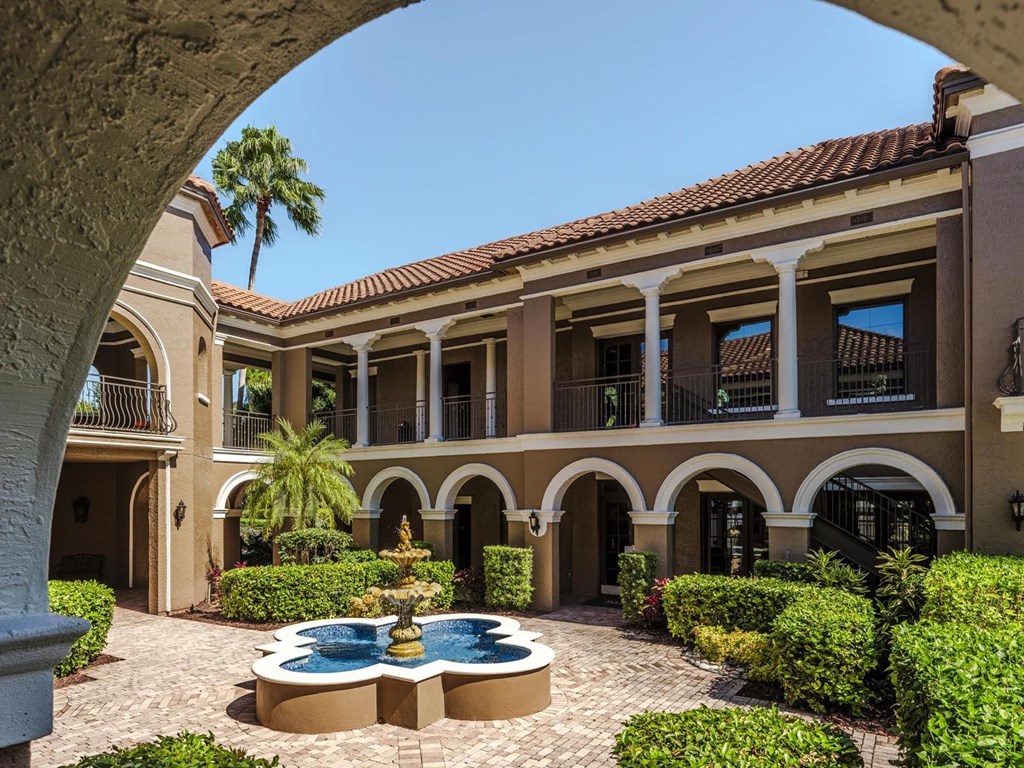 Arched walkways and landscaped courtyard featuring the iconic Magnolia Carillon fountain.